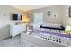 Bedroom with dual cribs, comfortable glider, and stylish decor at 2744 Calabria Ave, Davenport, FL 33897