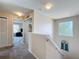 Upstairs hallway features a linen closet, window, and access to multiple bedrooms at 2744 Calabria Ave, Davenport, FL 33897