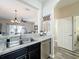 Bright kitchen featuring a stainless steel dishwasher and a double sink at 2744 Calabria Ave, Davenport, FL 33897