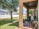 Covered patio area with backyard views and landscaping at 2744 Calabria Ave, Davenport, FL 33897