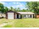 Charming single-story home with brick accents and a well-maintained front lawn and lovely landscaping at 288 Howard Blvd, Longwood, FL 32750