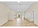 Bright living room with wood-look flooring and view to kitchen and backyard at 288 Howard Blvd, Longwood, FL 32750
