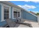 This balcony has 2 lounge chairs and a great view of the neighborhood at 316 Solaris Wharf St, Winter Springs, FL 32708