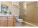 Bright bathroom featuring a glass shower, tiled floor, and vanity with a marble countertop at 316 Solaris Wharf St, Winter Springs, FL 32708