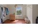 This walk-in closet has wood floors, organizers, shelving, and a small window at 316 Solaris Wharf St, Winter Springs, FL 32708