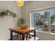 Dining area near the pool featuring a table, seating, and bright natural light at 316 Solaris Wharf St, Winter Springs, FL 32708