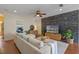Comfortable living room with an accent wall and a mounted television at 316 Solaris Wharf St, Winter Springs, FL 32708
