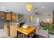 Open-concept kitchen and living room with sleek decor and ample natural light at 316 Solaris Wharf St, Winter Springs, FL 32708