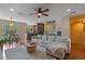 Open-concept living room with modern decor and wood floors at 316 Solaris Wharf St, Winter Springs, FL 32708