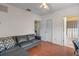 Living room featuring wood floors, a ceiling fan, and access to a bathroom at 316 Solaris Wharf St, Winter Springs, FL 32708