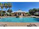 View of the community pool with a fountain feature, cabana, and lounge chairs for residents' relaxation at 316 Solaris Wharf St, Winter Springs, FL 32708