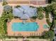 Aerial view of a community pool, featuring ample lounge chairs and lush tropical landscaping at 316 Solaris Wharf St, Winter Springs, FL 32708