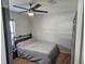 A cozy bedroom featuring soft carpeting and a ceiling fan for added comfort at 326 Woodland Trl, Lady Lake, FL 32159