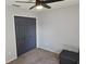 Neutral bedroom with large closet and ceiling fan at 326 Woodland Trl, Lady Lake, FL 32159