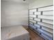 Bedroom featuring large shelving unit and neutral carpet at 326 Woodland Trl, Lady Lake, FL 32159