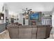 Large living room with a sectional couch, entertainment center, and open layout at 326 Woodland Trl, Lady Lake, FL 32159