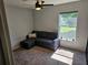 Cozy living room with modern ceiling fan and natural light from the window at 326 Woodland Trl, Lady Lake, FL 32159
