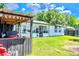 Backyard with a covered patio, grill area, and well-maintained lawn at 3328 Fox Ridge, Winter Haven, FL 33884