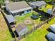 Fenced backyard with lawn, patio, storage shed, and a trampoline at 3328 Fox Ridge, Winter Haven, FL 33884