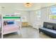 Bright bedroom featuring tile floors, bunk beds, and natural light at 3328 Fox Ridge, Winter Haven, FL 33884