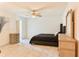 Bright primary bedroom with neutral walls, a ceiling fan, tile floors, and closet at 3328 Fox Ridge, Winter Haven, FL 33884