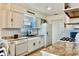 Well-lit kitchen features white cabinets and modern appliances at 3328 Fox Ridge, Winter Haven, FL 33884