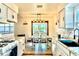 Bright eat-in kitchen with modern appliances, tile flooring, and outdoor view at 3328 Fox Ridge, Winter Haven, FL 33884