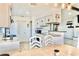 Kitchen with tile flooring, granite countertops, stainless sink, opens to the dining and living areas at 3328 Fox Ridge, Winter Haven, FL 33884