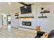 Inviting living room featuring a modern fireplace and floating shelves at 3328 Fox Ridge, Winter Haven, FL 33884
