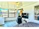 Enclosed patio with tiled floor, tv, and ceiling fan at 3328 Fox Ridge, Winter Haven, FL 33884