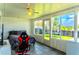 Enclosed sunroom with ample light, tile floors and view of the outdoor trampoline at 3328 Fox Ridge, Winter Haven, FL 33884