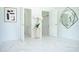 Elegant bedroom with art and mirror, and an open closet with great flooring at 337 Giovani Blvd, Clermont, FL 34715
