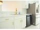 Bright kitchen featuring stainless steel appliances, white cabinets, and a marble countertop at 337 Giovani Blvd, Clermont, FL 34715