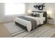 Stylishly staged main bedroom with a plush bed and sophisticated decor at 337 Giovani Blvd, Clermont, FL 34715