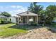 Charming single-story home with a covered front porch, landscaping, and a well-maintained lawn at 3601 Midiron Dr, Winter Park, FL 32789