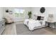 Charming bedroom with a cozy rug, patterned pillows, and bright natural light at 3777 Sw 130Th Loop, Ocala, FL 34473