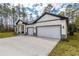 This house has a long driveway, a two-car garage and great curb appeal at 3777 Sw 130Th Loop, Ocala, FL 34473