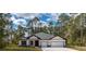 Beautiful single-story home with a manicured lawn and a two-car garage at 3777 Sw 130Th Loop, Ocala, FL 34473