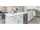 Bright kitchen showcasing a spacious island with quartz countertops and stainless steel appliances at 3777 Sw 130Th Loop, Ocala, FL 34473