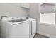 Laundry room area featuring brand new Samsung washer and dryer and plenty of room for storage at 3777 Sw 130Th Loop, Ocala, FL 34473