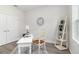 Bright and simple office with large window, white desk, and modern decor at 3777 Sw 130Th Loop, Ocala, FL 34473