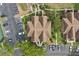 Aerial view of condo complex featuring ample parking, verdant landscaping, and walkways at 390 Lake Placid Ct # 304, Altamonte Springs, FL 32701