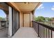Balcony with a wood railing and a view of trees and other townhomes at 390 Lake Placid Ct # 304, Altamonte Springs, FL 32701