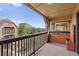 Balcony with a wood railing and a view of trees and other townhomes at 390 Lake Placid Ct # 304, Altamonte Springs, FL 32701