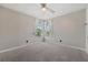 Bedroom with neutral walls, carpet flooring, a ceiling fan and bright natural light at 390 Lake Placid Ct # 304, Altamonte Springs, FL 32701