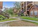 Exterior view featuring building stairways, lush landscaping, and accessible walkways, enhancing the complex's appeal at 390 Lake Placid Ct # 304, Altamonte Springs, FL 32701