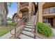 Apartment building with exterior staircases, providing access to upper-level units and a view of the complex at 390 Lake Placid Ct # 304, Altamonte Springs, FL 32701