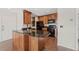 Functional kitchen featuring wooden cabinets, granite countertops, and modern appliances, perfect for culinary enthusiasts at 390 Lake Placid Ct # 304, Altamonte Springs, FL 32701
