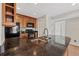 Well-lit kitchen featuring dark granite counters and stainless steel sink under wooden cabinets at 390 Lake Placid Ct # 304, Altamonte Springs, FL 32701