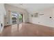 Bright living area with vaulted ceiling, wood floors, balcony access, and a decorative mirror at 390 Lake Placid Ct # 304, Altamonte Springs, FL 32701